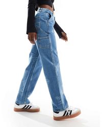 Carhartt - Ruimvallende Jeans Met Rechte Pasvorm En Stempelprint - Lyst