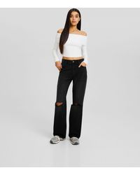 Bershka - Jeans strappati a fondo ampio stile anni '90 neri - Lyst