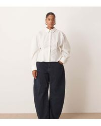 ARRANGE - Curve Tova Tapered Curved Leg Jeans With Roll Hem - Lyst