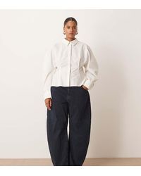 ARRANGE - Curve Tova Tapered Curved Leg Jeans With Roll Hem - Lyst