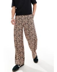 Reclaimed (vintage) - Pantaloni ampi unisex con stampa leopardata - Lyst
