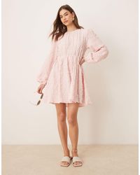 Gina Tricot - Textured Mini Dress With Open Tie Back And Volume Sleeves - Lyst