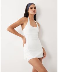 4505 - Active Halterneck Tennis Dress With Under Shorts - Lyst