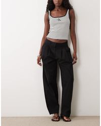 Aware - Pantaloni A Cilindro Neri Con Piega Doppia Sul Davanti - Lyst