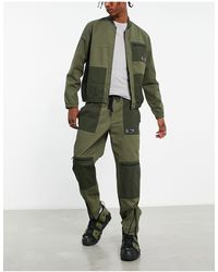 TOPMAN - Pantalon cargo d'ensemble ample effet coupé-cousu avec taille élastique - kaki - Lyst
