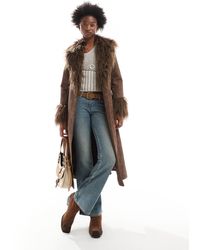 Reclaimed (vintage) - Longline Leather Look Mac With Faux Fur Collar - Lyst