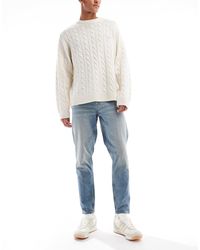 ASOS - Jean fuselé - clair délavé - Lyst
