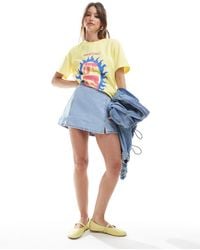 Stradivarius - Jupe-short courte en jean à ourlet fendu - clair délavé - Lyst