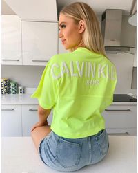 Calvin Klein – es T-Shirt mit Schaumdruck-Logo am Rücken - Gelb