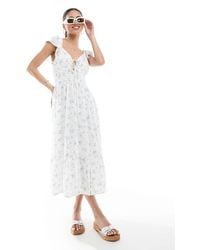 Hollister - Vestido Midi De Manga Corta De Estilo Mesonera Con Estampado Floral Azul Y Abertura De - Lyst