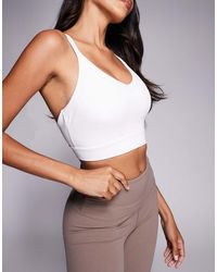 4505 - Fuller Bust Icon Active Medium Support Sports Bra With Removable Padding And Adjustable Straps - Lyst