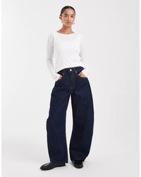 ASOS - Asos design petite - jean ample à taille haute - brut délavé - Lyst