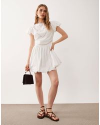 asos mini skater dress with butterfly embroidery ASOS DESIGN strappy mini dress with butterfly embroidery in lilac