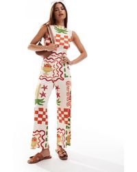 ASOS - – culotte-jumpsuit mit postkartenprint, schlitzausschnitt und rückenausschnitt mit schnürung - Lyst