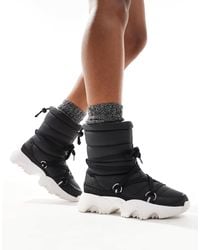 Sorel - Kinetic impact nxt wp - après-ski matelassées imperméables avec doublure en polaire - /sel - Lyst