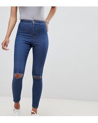 ASOS Rivington - Jeggings a vita alta con strappi sfrangiati sulle ginocchia stone wash blu medio slavato
