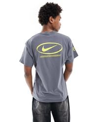 Nike - Camiseta con logo central swoosh - Lyst
