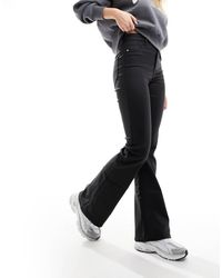 River Island - Flared Jeans Met Hoge Taille En Coating - Lyst