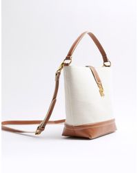 River Island - Canvas Lock Bucket Bag - Lyst