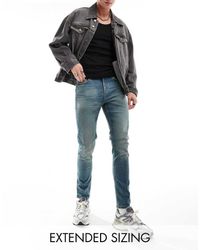 ASOS - Vaqueros Ajustados En Azul Lavado Medio De - Lyst