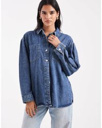 Vero Moda - Chemise en jean oversize - moyen délavé - Lyst