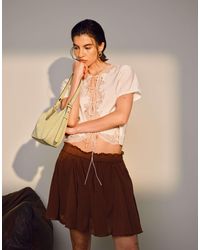 TOPSHOP - Top délicat à mancherons avec empiècement en dentelle et liens noués sur l'avant - ivoire - Lyst