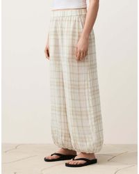 Oysho - Long Checked Bloomer Trousers With Side Pockets.65% Linen - Lyst