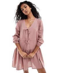 esmé studios - Esmee Exclusive Linen Mix Long Sleeve Tiered Mini Tie Front Beach Dress - Lyst