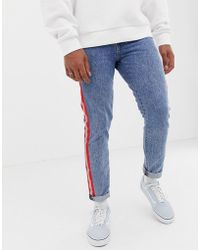 Levi's 512 Reflective Side Stripe Tape Slim Tapered Fit Jeans In Acid Light Wash - Blue