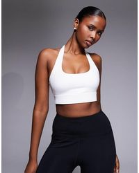4505 - Active Halter Neck Performance Medium Support Sports Bra With Removable Padding - Lyst