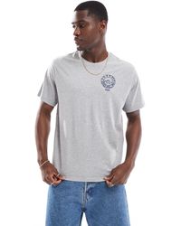 Levi's - T-shirt mélange vestibilità comoda con logo e stampa di spiaggia - Lyst