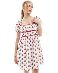 The Frolic - Exclusive Scallop Trim Square Neck Puff Sleeve Bow Tie Back Mini Dress - Lyst