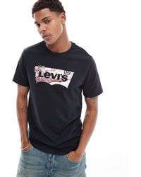 Levi's - Camiseta negra con logo tropical en forma - Lyst