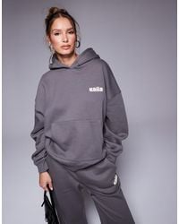 Kaiia - Studio - sweat à capuche oversize d'ensemble avec imprimé logo bulle au dos - foncé et jaune - Lyst