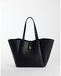 ASOS - Borsa Shopping Nera Con Ali E Lucchetto - Lyst