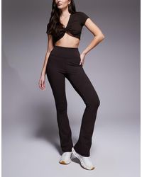 4505 - Hourglass Icon High Waist Slim Kick Yoga legging - Lyst