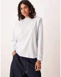 ASOS - Top A Maniche Lunghe Girocollo Celeste Chiaro Con Collo Alto E Spalline Imbottite - Lyst