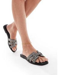 SEQWL - Sandalias Negras Planas De Rafia Stork De -Negro - Lyst