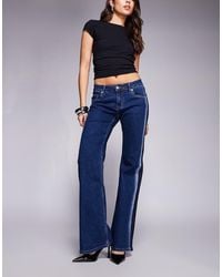 Edikted - Airbrushed Low Rise Flared Jeans - Lyst