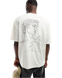 ASOS - T-shirt oversize sporco con stampa di statua sul petto e sul davanti - Lyst