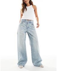 Calvin Klein - Jean large à logo effet vieilli - clair délavé - Lyst