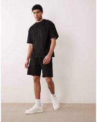 River Island - Set Van Boxy Oversized T-Shirt En Short - Lyst