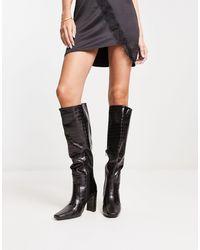 Truffle Collection - Stivali al ginocchio neri con tacco e punta squadrata - Lyst