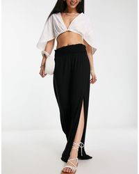 ASOS - Falda larga negra con cintura fruncida y abertura - Lyst