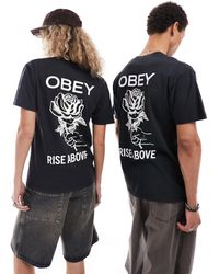 Obey - T-shirt unisex nera con grafica con rosa e tinta a pigmenti - Lyst
