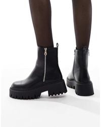 SEQWL - Botas Negras Con Suela Gruesa Y Detalle De Cremallera Stella De - Lyst