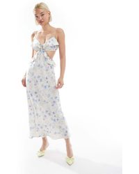 Love Triangle - Vestito Lungo Blu A Fiori Con Cut-Out E Volant - Lyst
