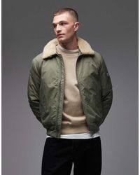 Schott Nyc - Cropped Gewatteerd Jack Met Logopatch, Ritsdetail En Kraag Van Imitatiebont - Lyst