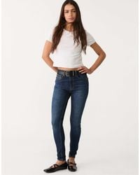 Stradivarius - – d07 – skinny jeans mit mittelhohem bund aus überfärbtem em denim - Lyst
