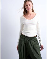 TOPSHOP - Rib V-neck Long Sleeve Curved Hem Top - Lyst